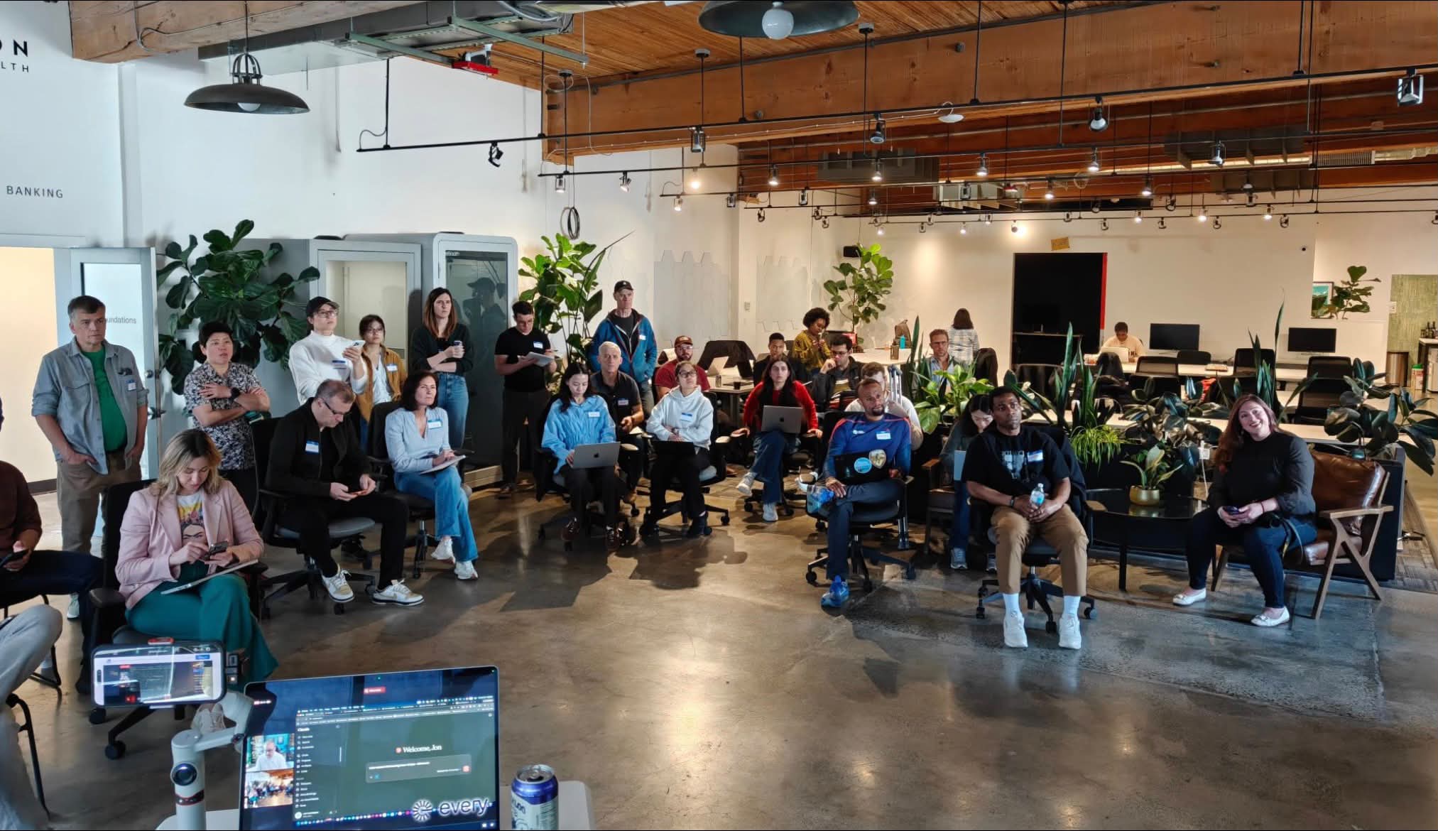 About thirty people with laptops at a Builder Day co-working session in Seattle